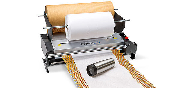 
			A paper machine produces brown and white paper for packaging